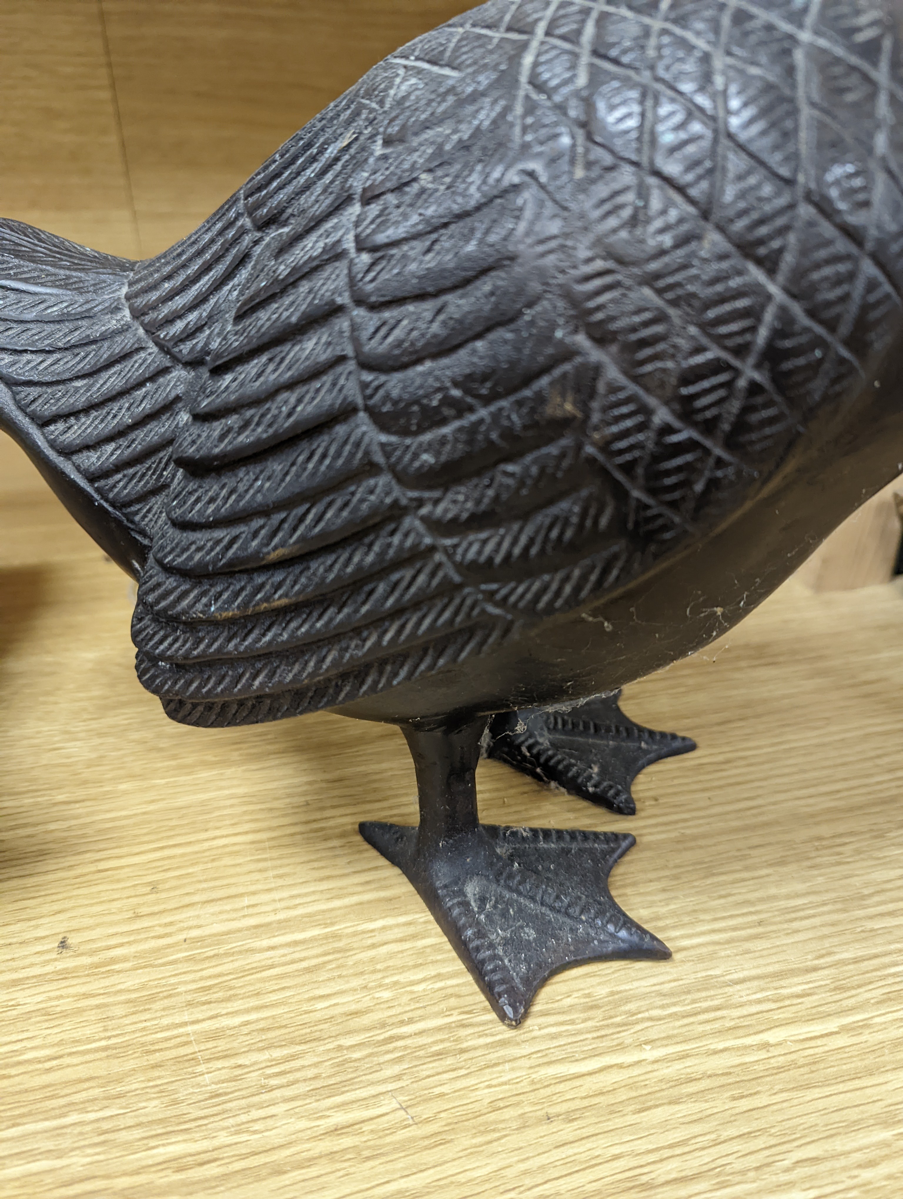A pair of modern Chinese bronze models of geese, largest 48cm
